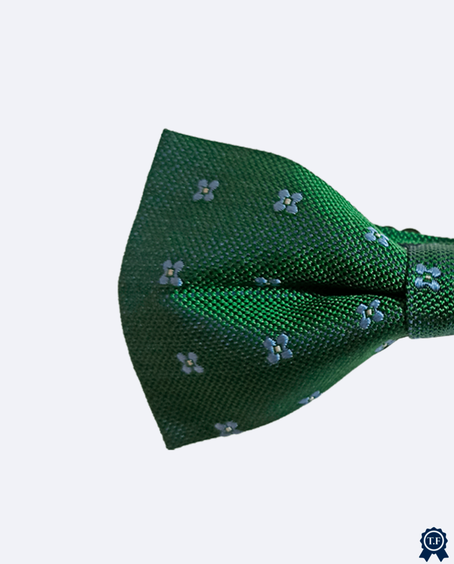 Pajarita verde con flores azules de seda