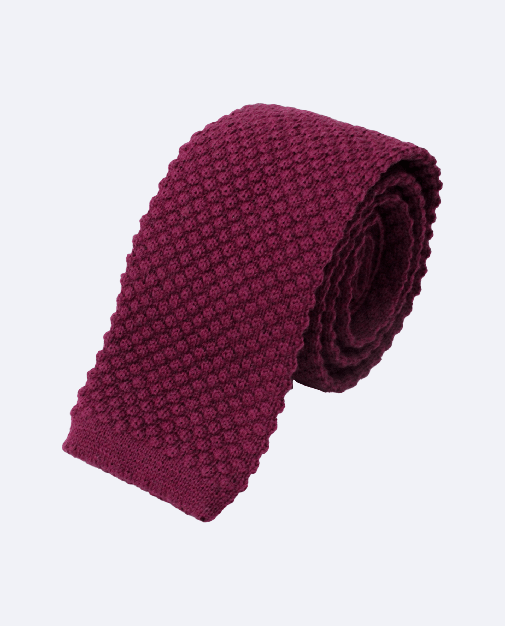 Corbata buganvilla de punto, confeccionada en 100% lana, vista enroscada