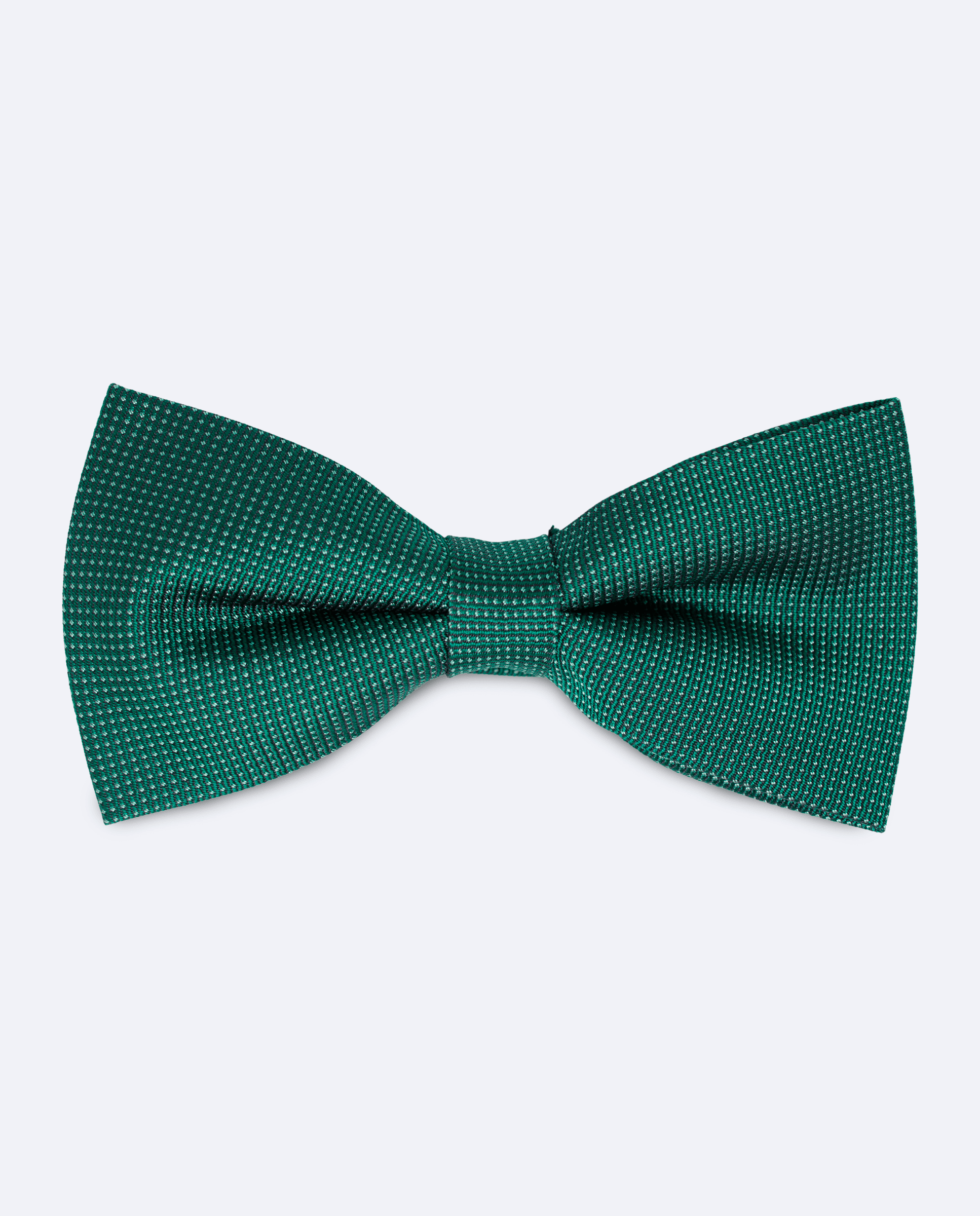 Pajarita verde botella, hecha a mano con diseño de micro lunares en verde menta, vista frontal