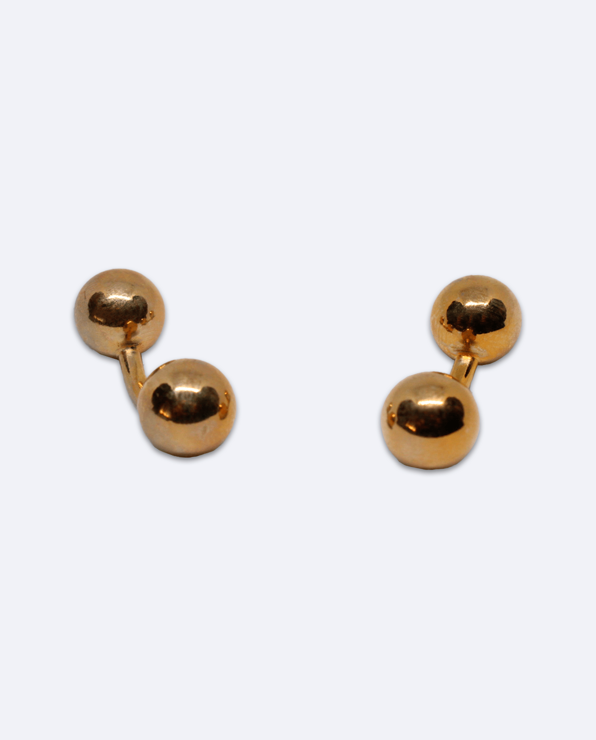 Gemelos de metal dorado con diseño de doble bola, vista general