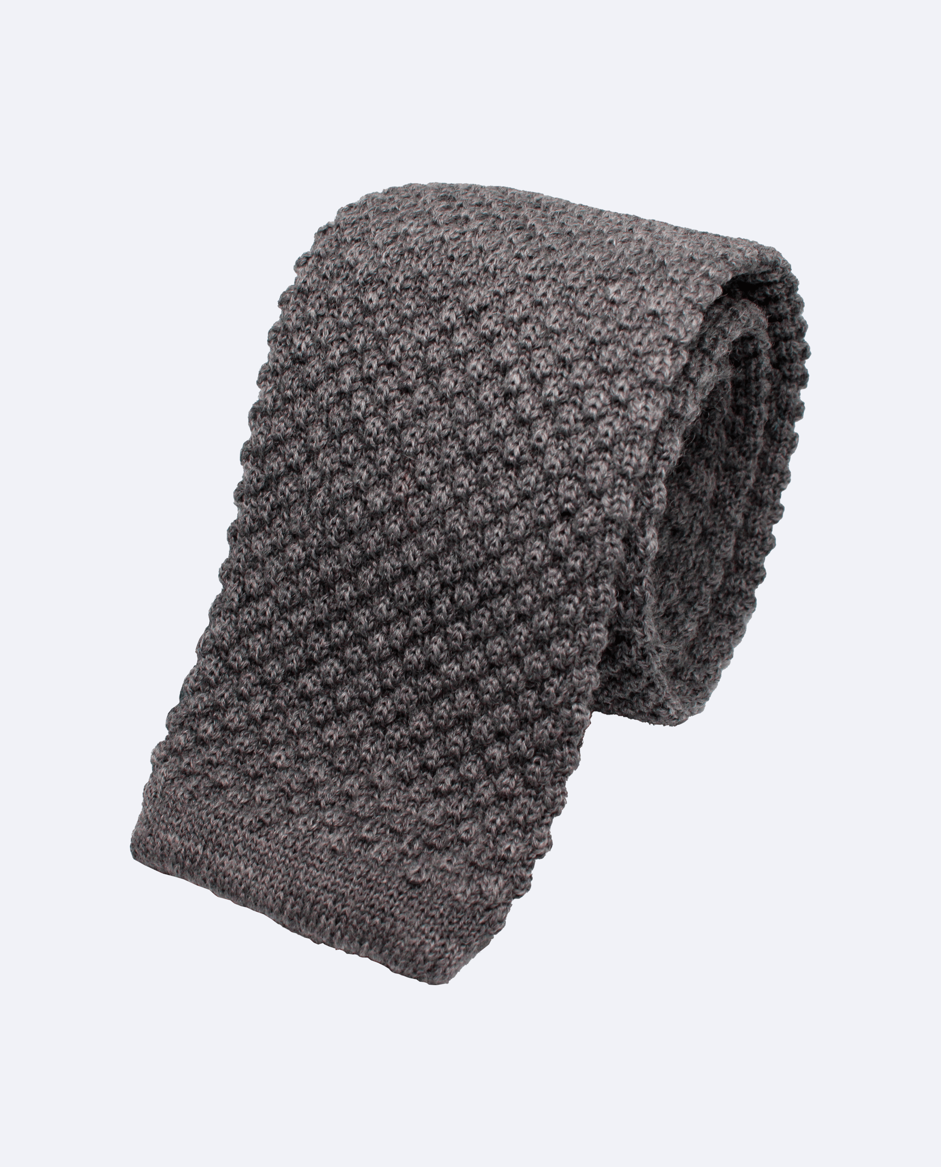 Corbata de punto gris, confeccionada en 100% lana italiana, vista enroscada