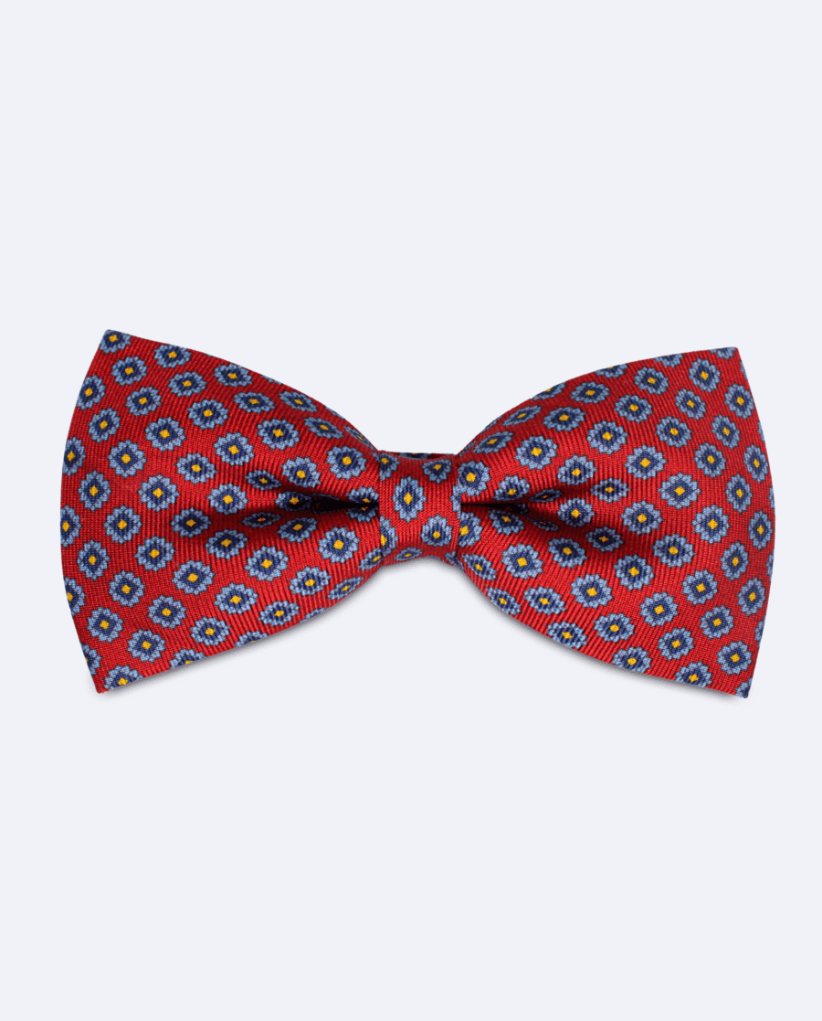 Pajarita roja con diseño floral azul