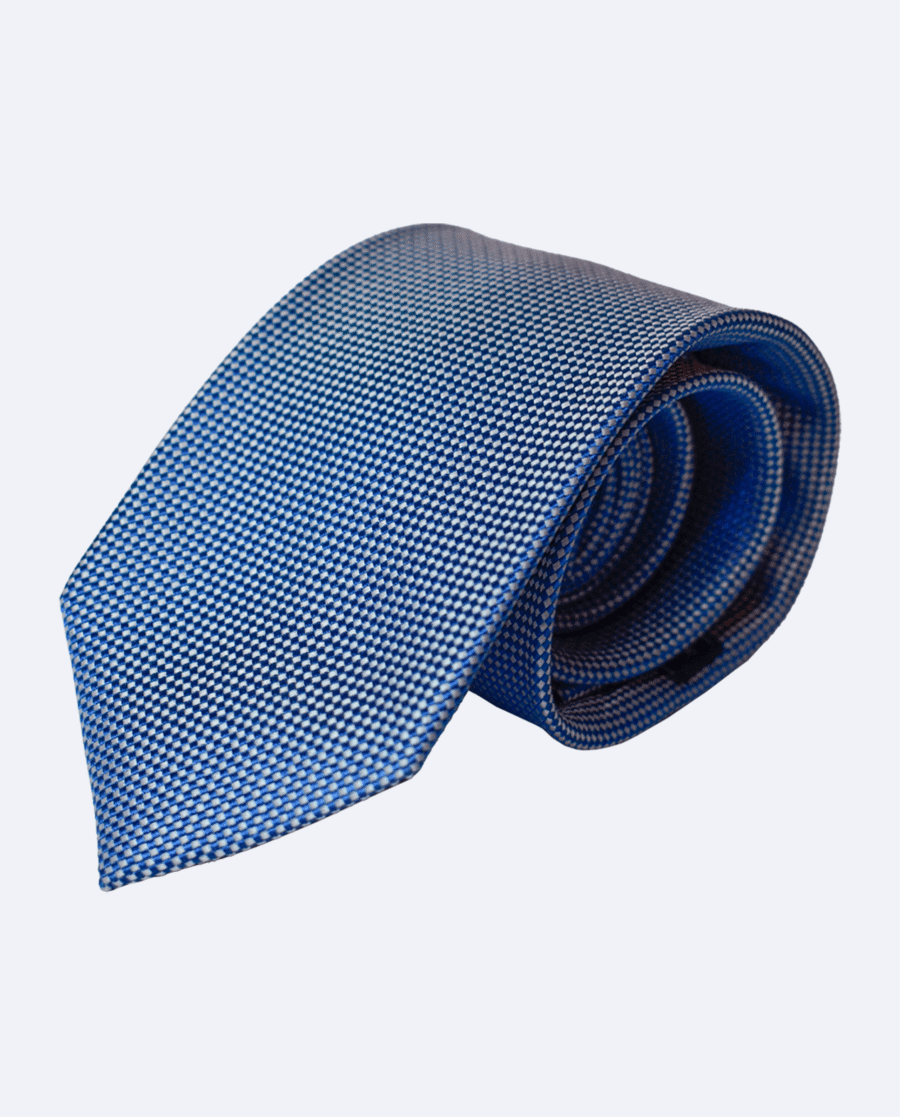 Corbata de seda azul con microrombos blancos