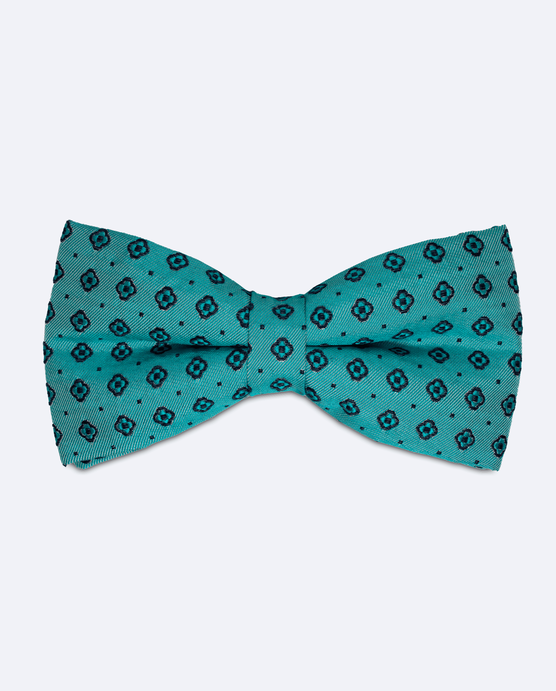 Pajarita azul cian con diseño jacquard de flores, hecha a mano en 100% seda italiana, vista frontal
