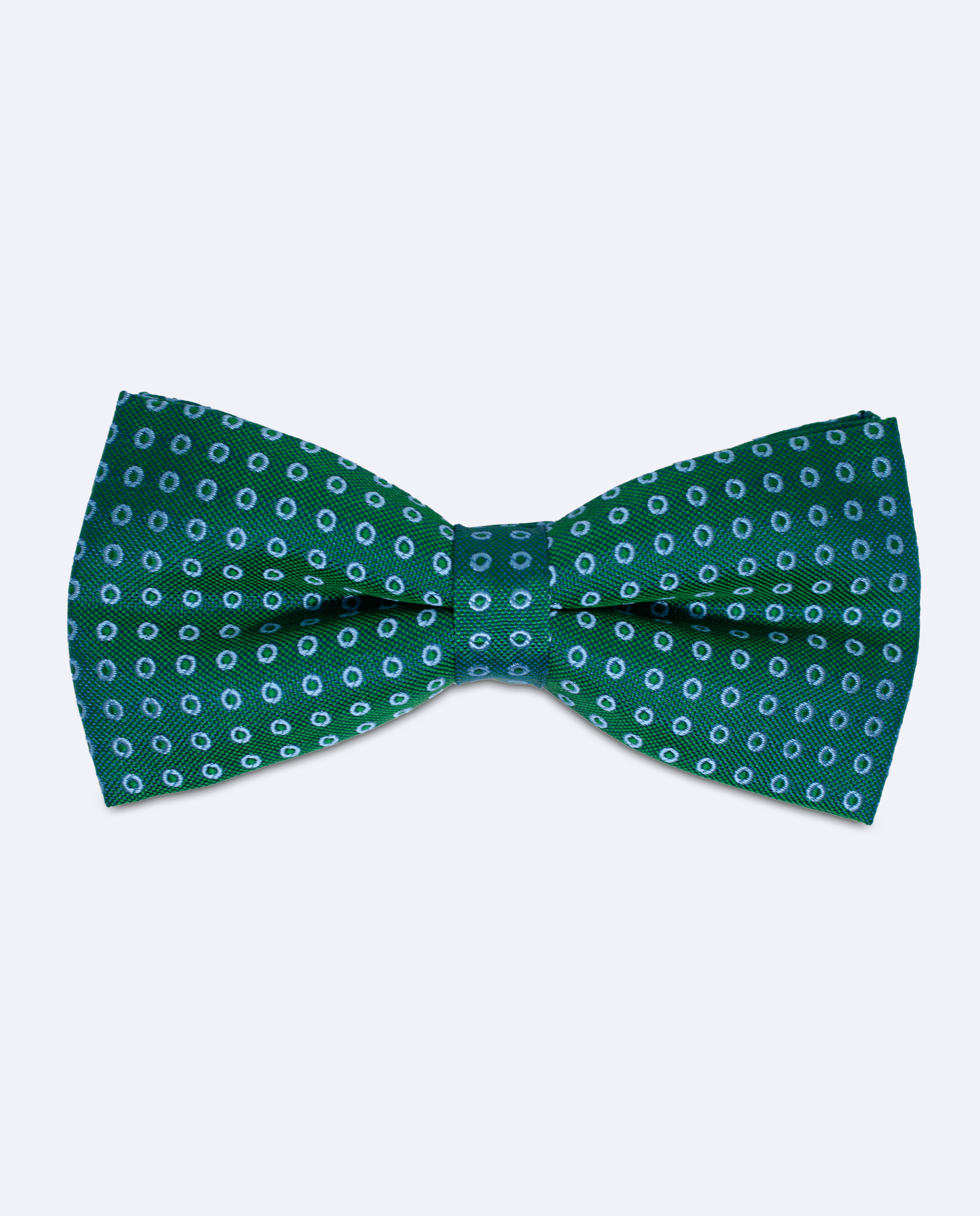 Pajarita verde esmeralda con motivos circulares azul claro, hecha a mano en 100% seda italiana, vista frontal